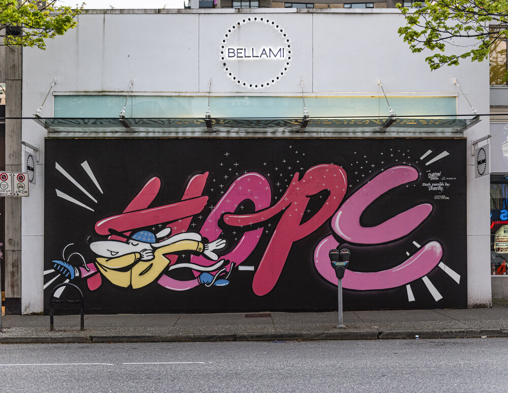 (Artist Credit: @Chairman_Ting, Vancouver, 2020) #MAKEARTWHILEAPART UPDATE - April 29, 2020 The artists want you all to know they have felt so blessed to be able to do this work. The outpouring of good will, gratitude and hope that folks have extended to the artists has been a beautiful thing! Thanks Vancouver for pulling together during this time and spreading the love. Check out #makeartwhileapart on IG and FB to see more art. If you snap a good pic, please use the hashtag! Check back here in a few weeks for the official VMF #MAKEARTWHILEAPART recap video. Want to support this project? Click here! Cheers, THE VMF TEAM __________________________________________________________________________________________________________________________________ UPDATE - April 18, 2020 ADDITIONAL MURALS With the fast developing size of the project, we have reached the limit of murals we can oversee production on for the time being. The purpose of this list is to connect artists with additional business who are interested in a mural. As new requests come in from local business owners, we will be happy to connect them with artists like you. It will be up to you to arrange your supplies, paint and access with the owner. For these additional murals, you will be managing your own project. You must be totally self-sufficient. When painting, we ask that you take extreme care and attend immediately to any spills or drippage. Note: While you will be responsible for negotiating your own fee with the business owner, we will make sure they know its is very important to compensate artists and will have that conversation with them before connecting them with you. By signing up, there is no guarantee of getting a wall. You are signing up to be on a waitlist. Thanks! Want to support this project? Click here! Want to be a part of the project as an artists? Please sign up here to be on file ____________________________________________________________________________________________________________________________________ APRIL 16, 2020 Vancouver Mural Festival is partnering with a number of local businesses and Business Improvement Associations to support local artists while bringing hope and positivity to the streets in the midst of the COVID-19 pandemic. With boarded up windows becoming an increasingly common occurrence in neighbourhoods across the city, VMF enlisted a large group of its alumni and other local artists to donate temporary mural work to these locations. We anticipated the creation of more than 40 temporary murals across several areas in only a few days. All artists will be designing imagery and messages to spark joy and/or celebrate the resilience of our communities; and will be paid an honorarium with supplies being be covered. HOW DOES IT WORK? In this time of uncertainty, we are drawing on our deep network of community partners, sponsors and local BIA’s to rapidly mobilize support for Vancouver’s artists and local businesses. 100% of the funds contributed by local BIA’s, Sponsors and the City are going directly to the artists, as VMF is waiving all fees, costs, and staff time for coordinating this program. During this project the City of Vancouver COVID-19 social distancing rules will remain in effect and all artists will be following health and safety regulations. While we understand the excitement of live mural painting we strongly urge the public to stay home and enjoy the progress of the murals by following the hashtag #MakeArtWhileApart through our Instagram and Facebook . MEDIA INQUIRES Adrian Sinclair Adrian@vanmuralfest.com