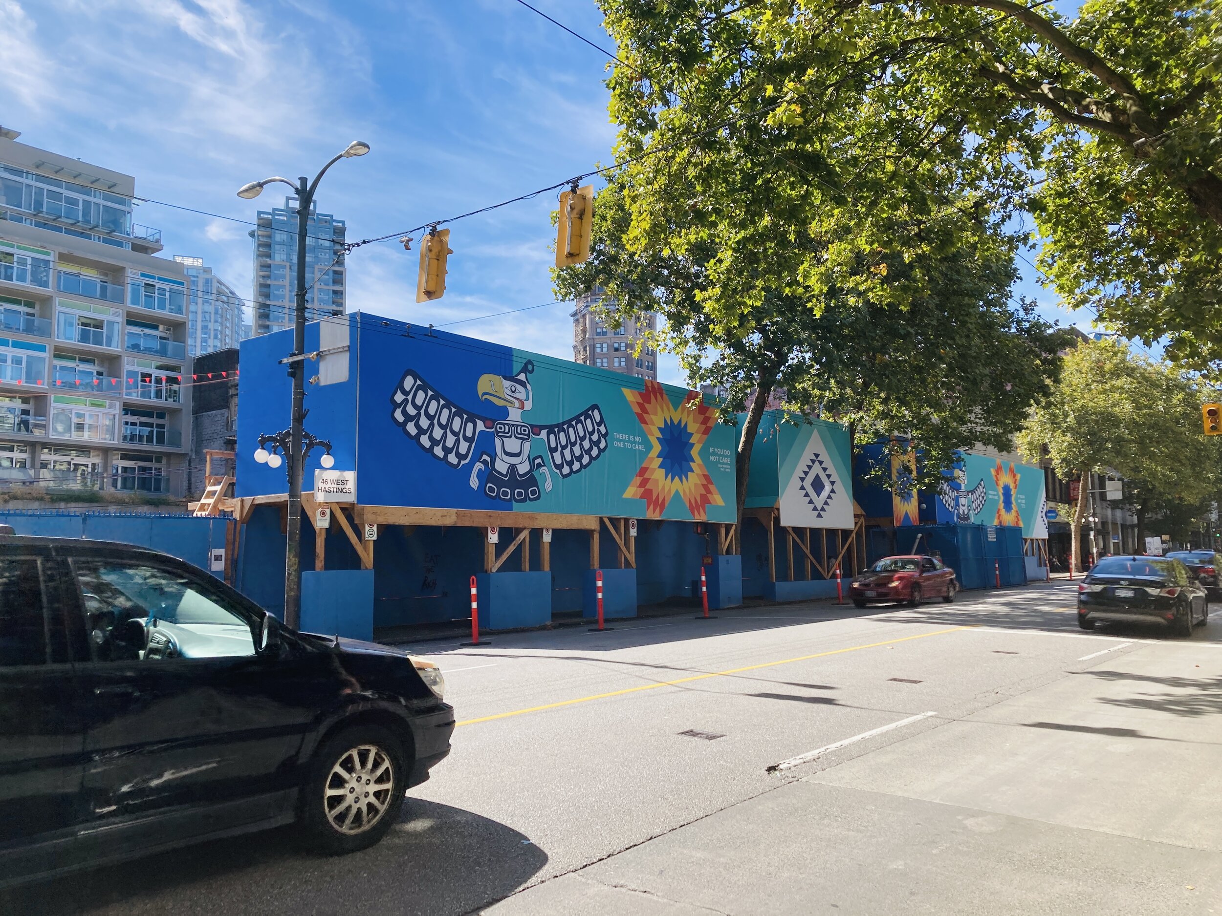Hoarding in Downtown Vancouver of Indigenous mural of Thunderbird and quilt symbols titled the Healing Quilt