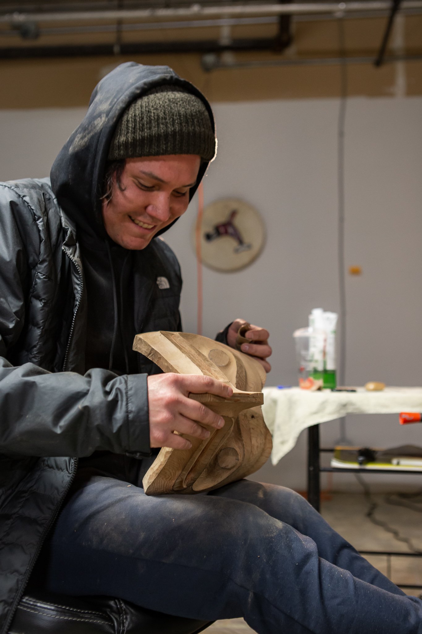 Indigenous artist Jonas Jones holding a mask, credit Sabrina Miso Creative
